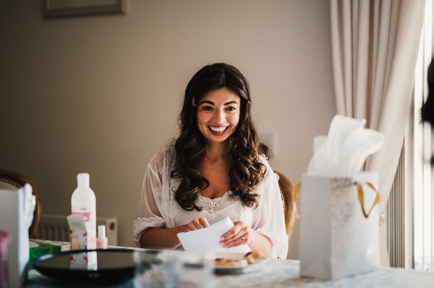 Joyful preparation scene with beauty products and morning light.