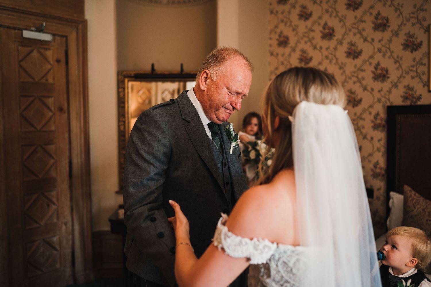 An emotional moment shared between two people during a wedding ceremony.