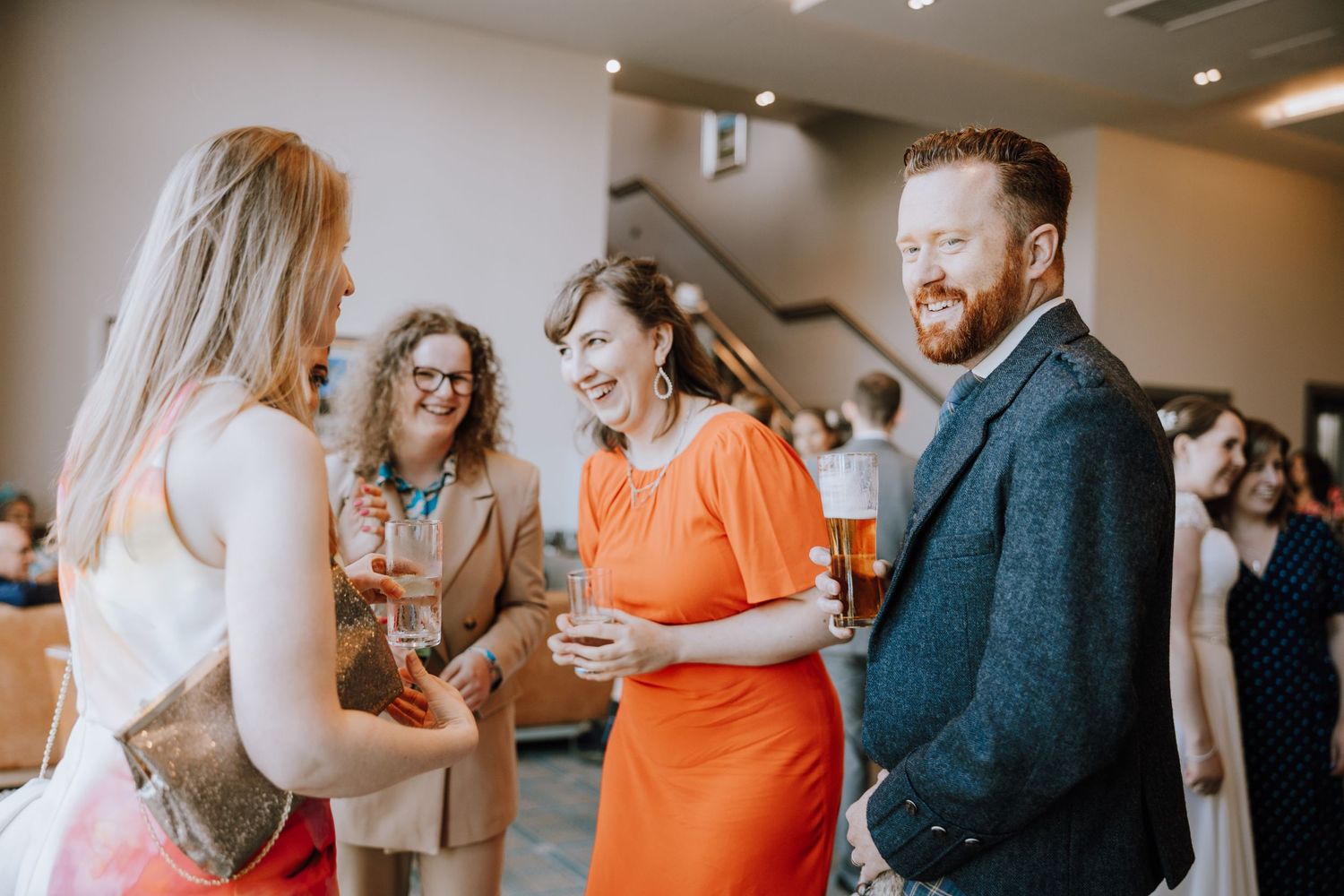 Candid moment of guests mingling during a wedding reception.