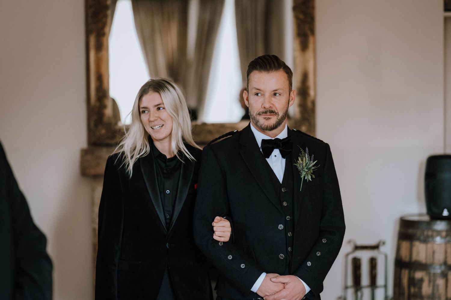 Logie House Wedding Photography. Wedding guests and party members gather indoors for formal celebration photos.