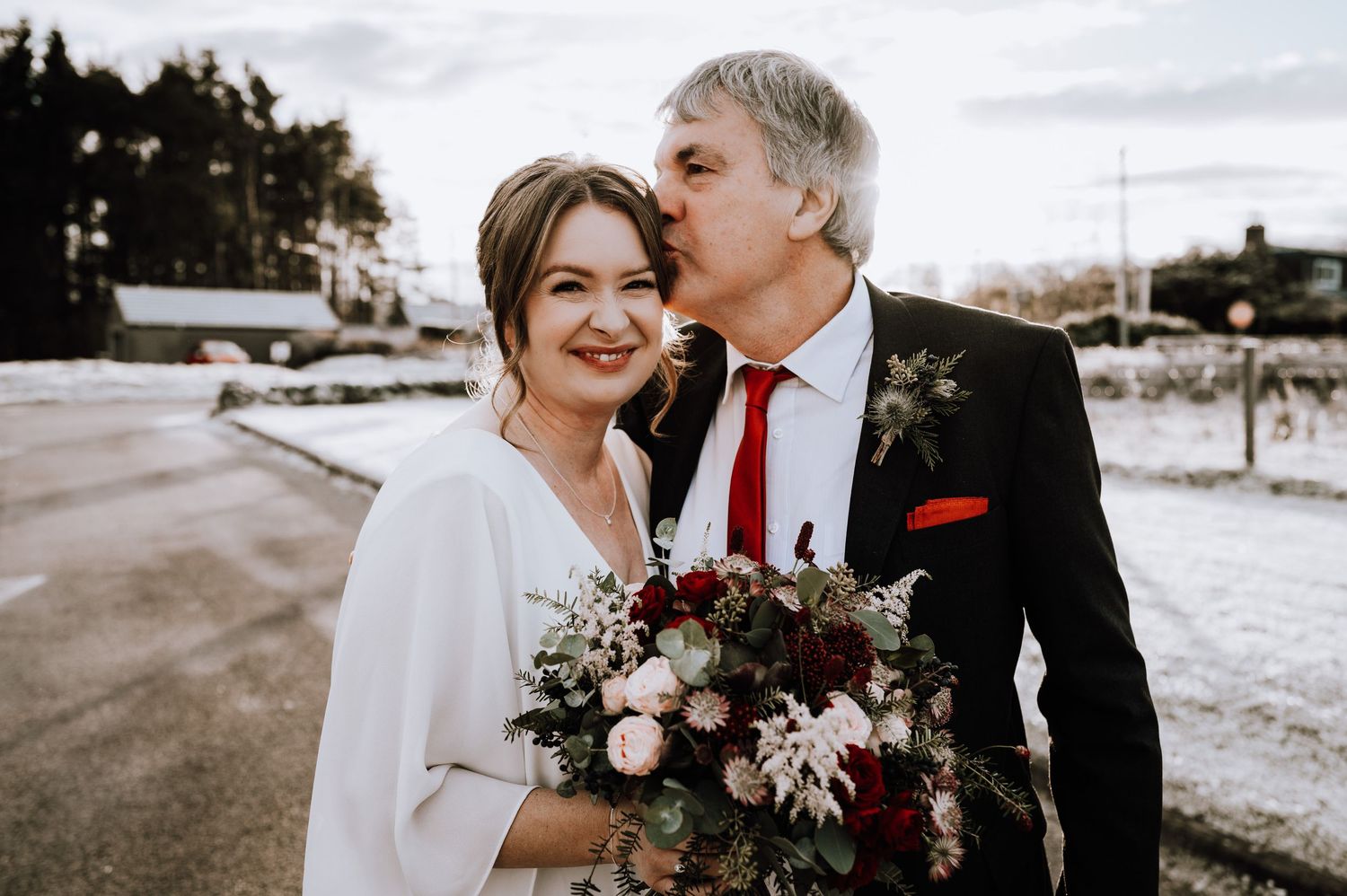 Same Sex Wedding Photography. Romantic winter wedding portraits with burgundy floral bouquet accents.