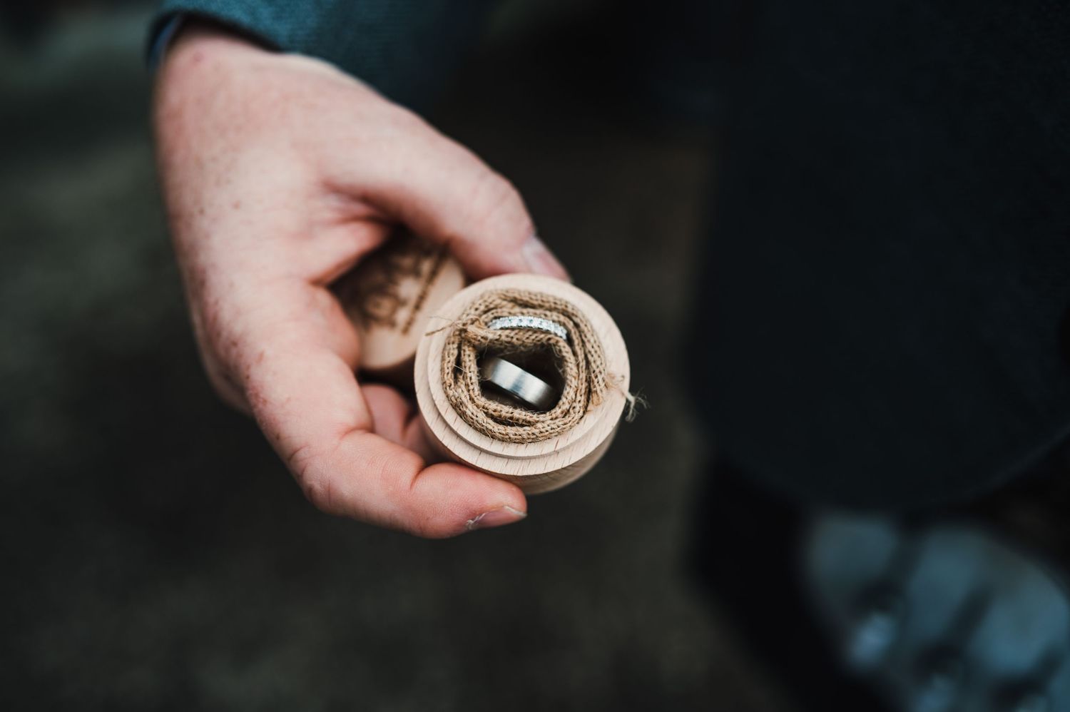 Close-up shots of hands holding rolled up documents or certificates.