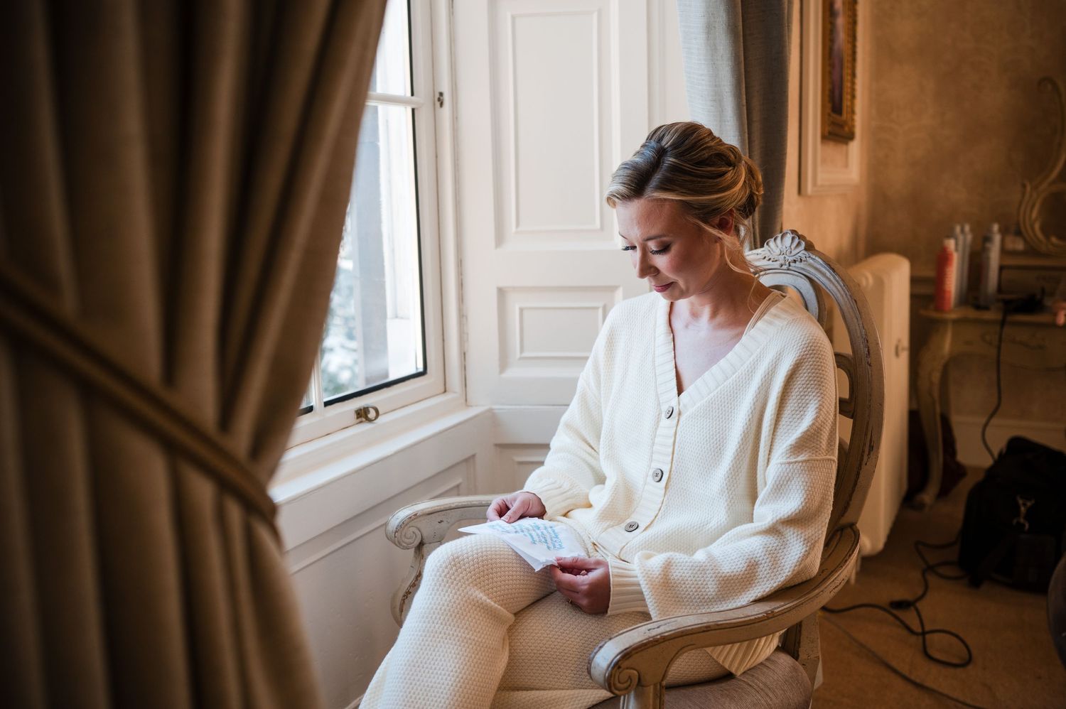 Aberdeen Wedding Photography. Morning preparation scene in warm-lit room with white robes.