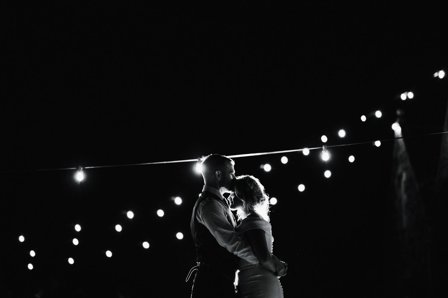 String lights create a romantic ambiance against a dark night sky.
