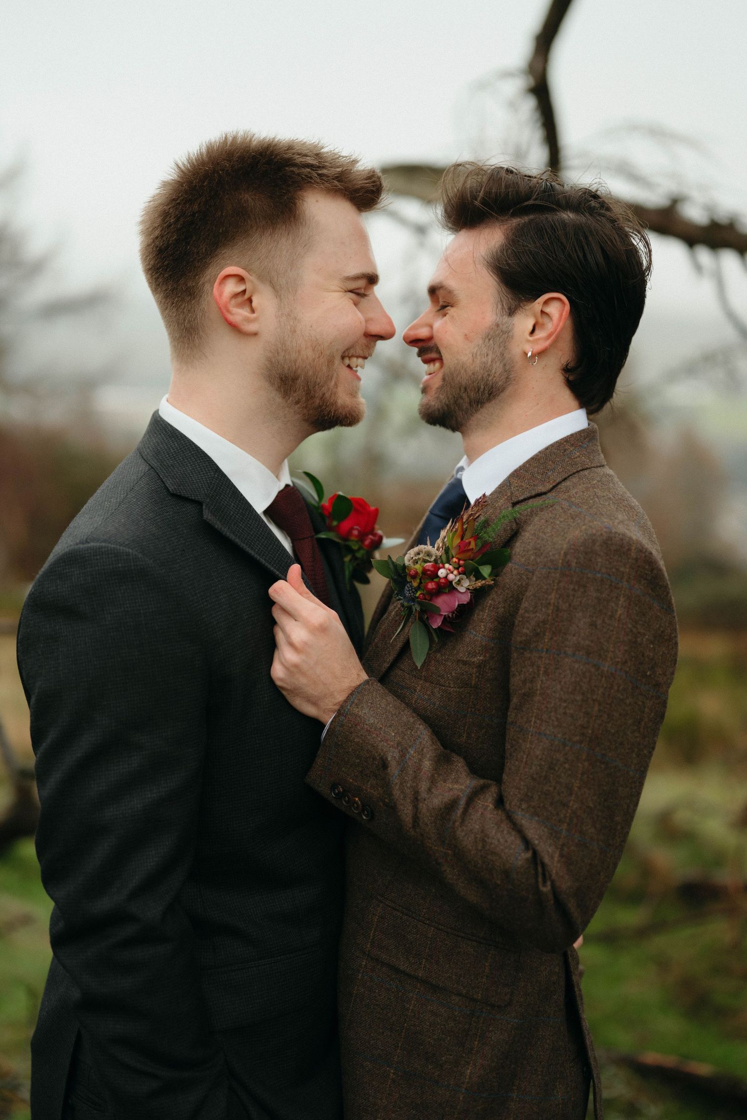 Drumtochty Castle  Wedding Photography. Two people in contrasting suits share an intimate moment during their outdoor wedding photoshoot.