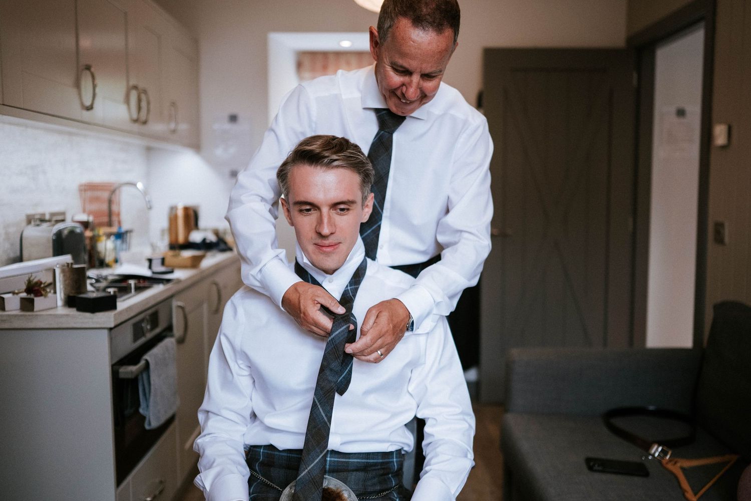 Candid moments of wedding party preparations in a bright room.