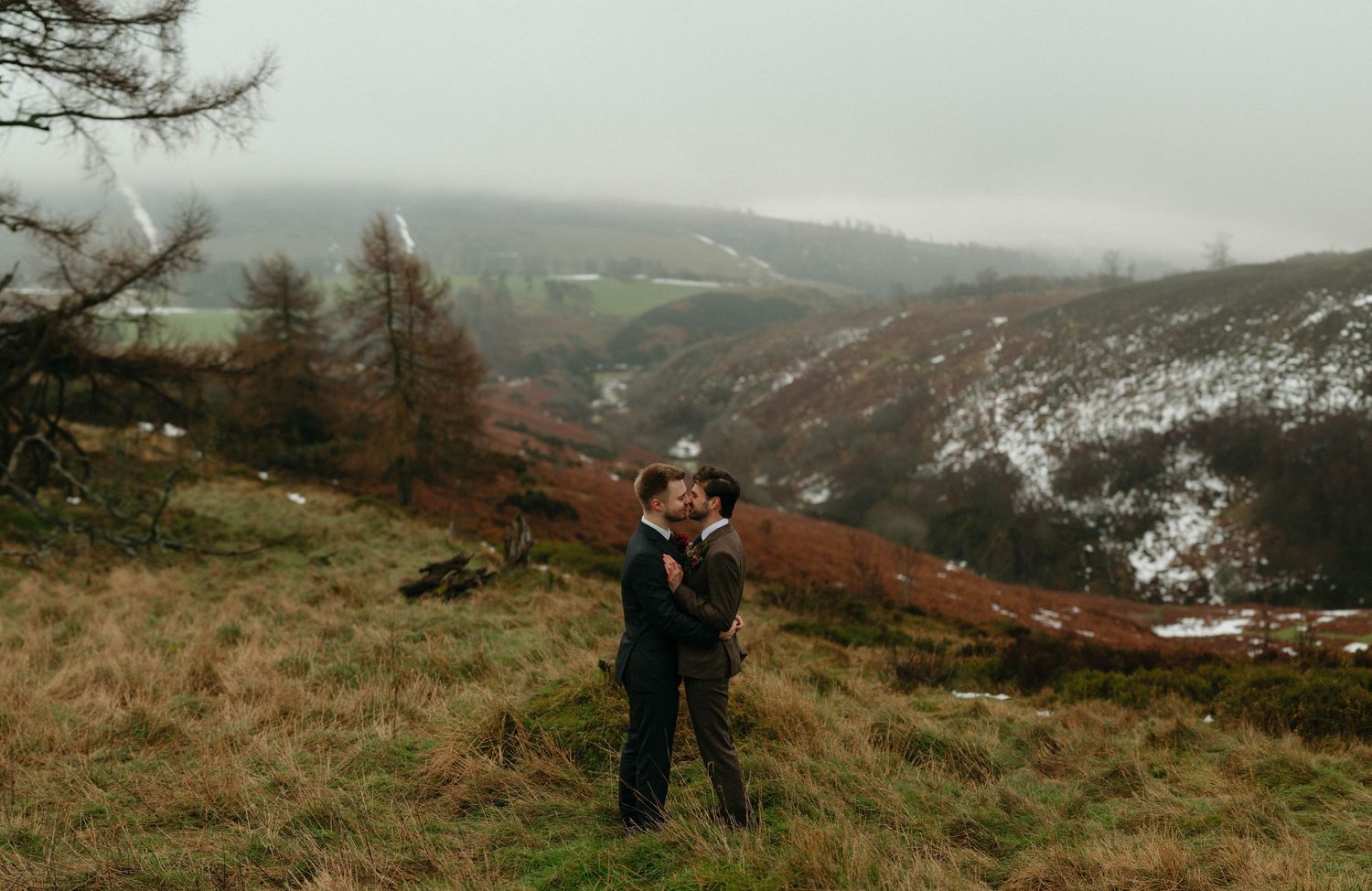 Aberdeen Wedding Photography. Wedding couple explores scenic mountain landscape during winter photoshoot.