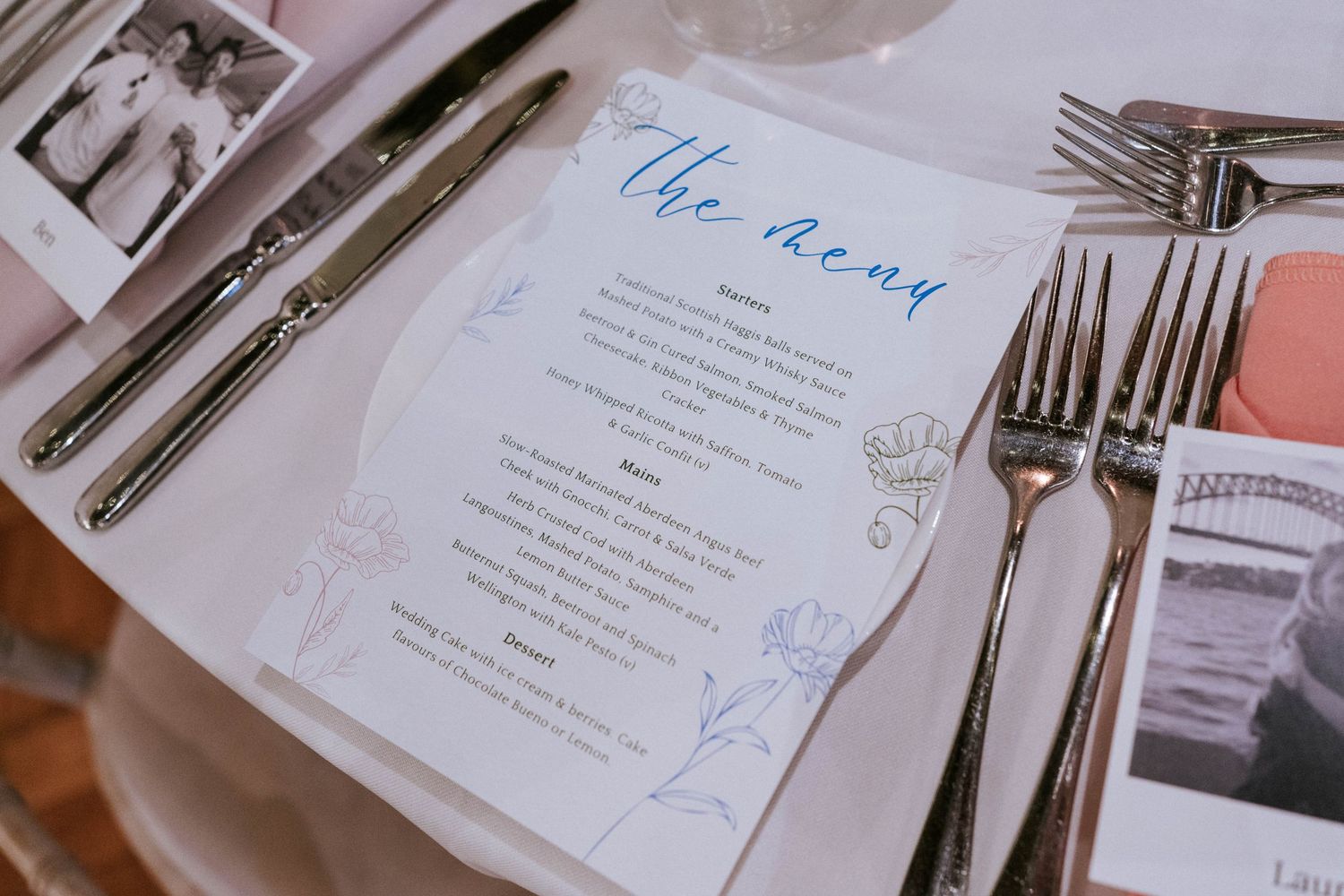 Wedding menu card and silverware place setting with vintage styling.
