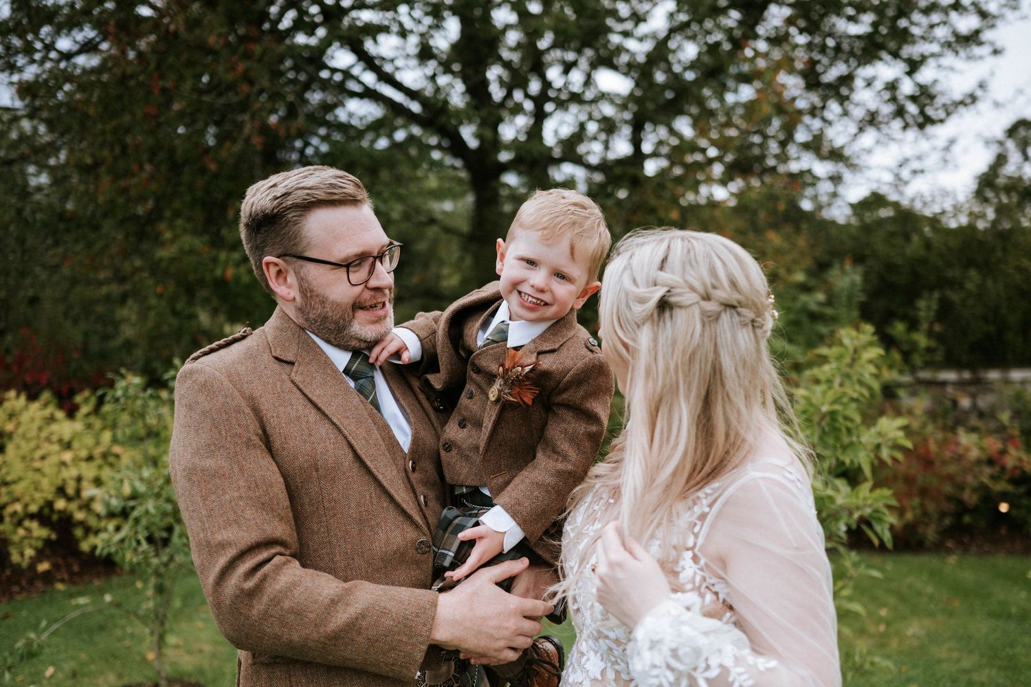 Wedding celebration taking place on the grounds of a historic estate.