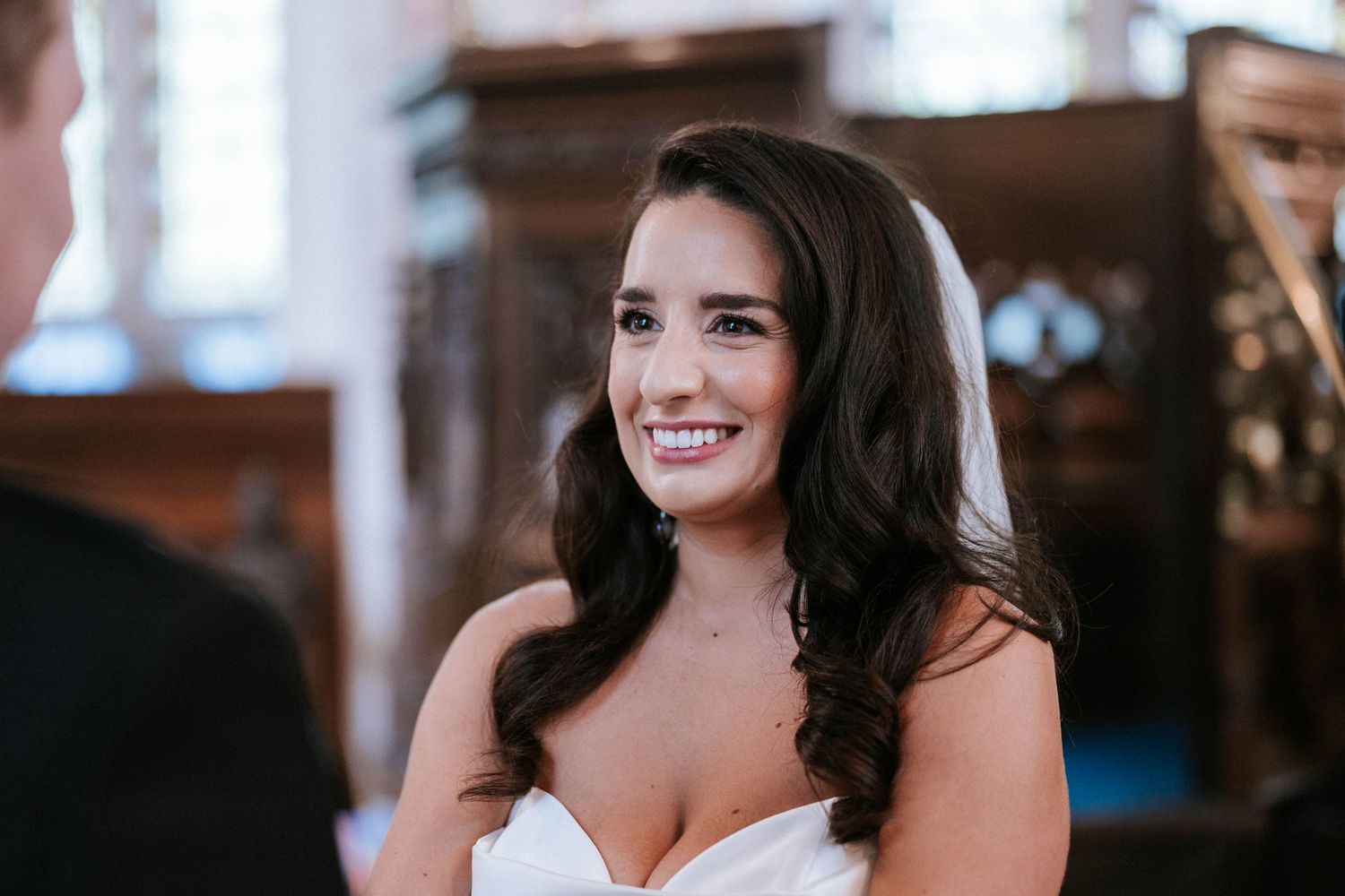 Wedding celebration captured in a series of candid moments inside a historic church.