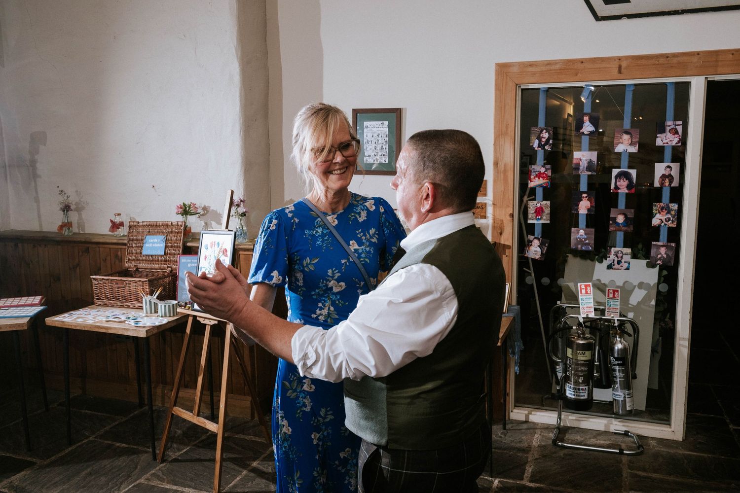 Wedding celebration in a cozy indoor venue with warm lighting and wooden details.