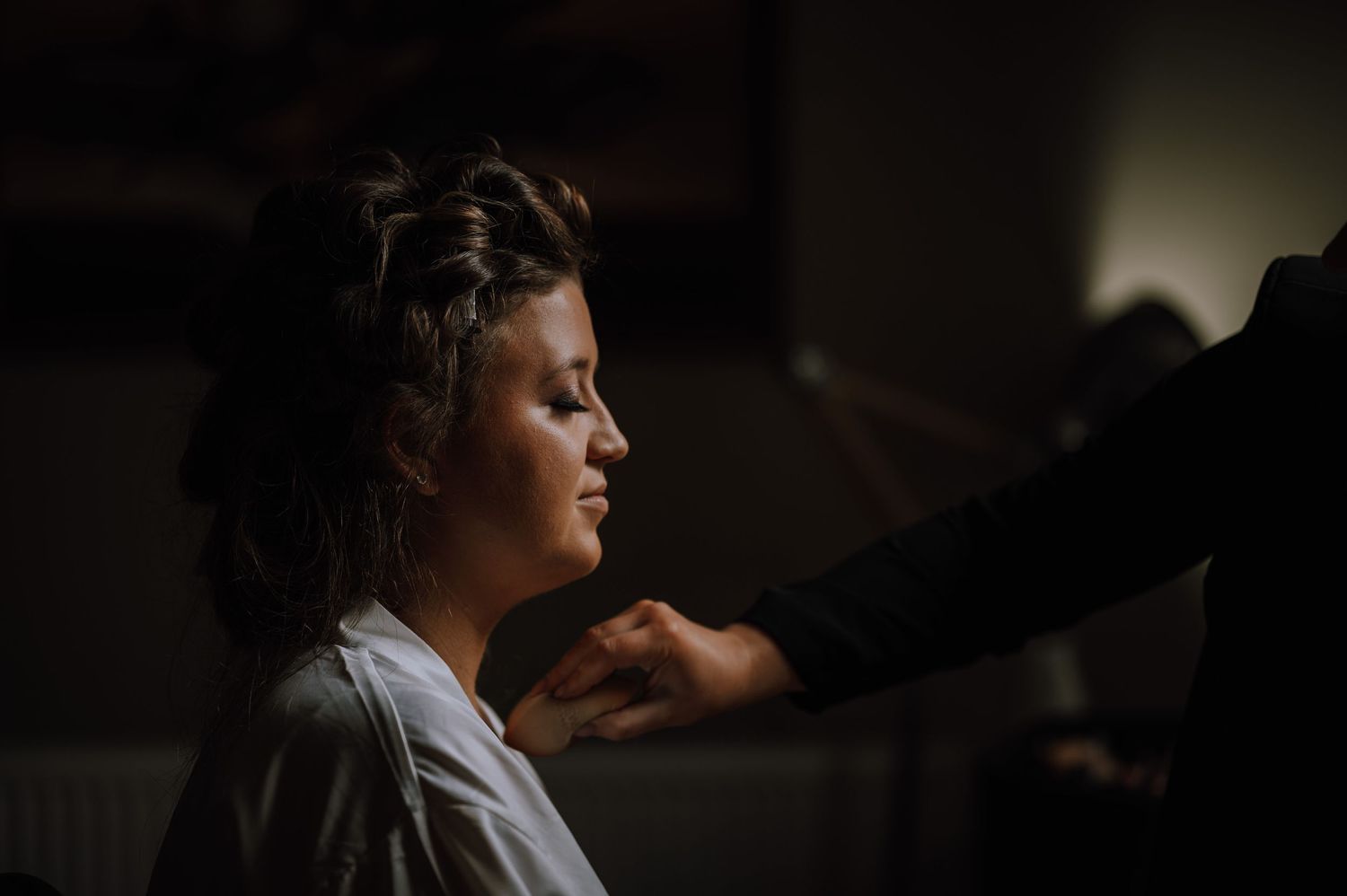 An atmospheric getting ready scene with morning wedding preparations in soft lighting.
