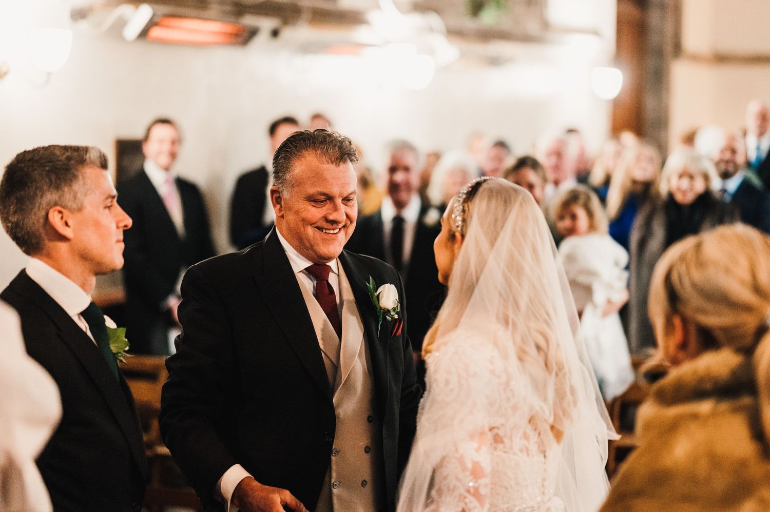 Joyful moments shared during a traditional church wedding ceremony with guests looking on.