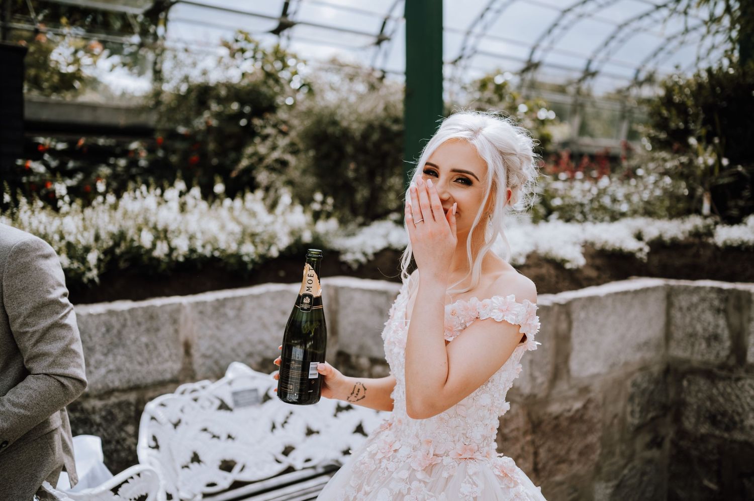 A candid moment captured during an outdoor wedding reception.