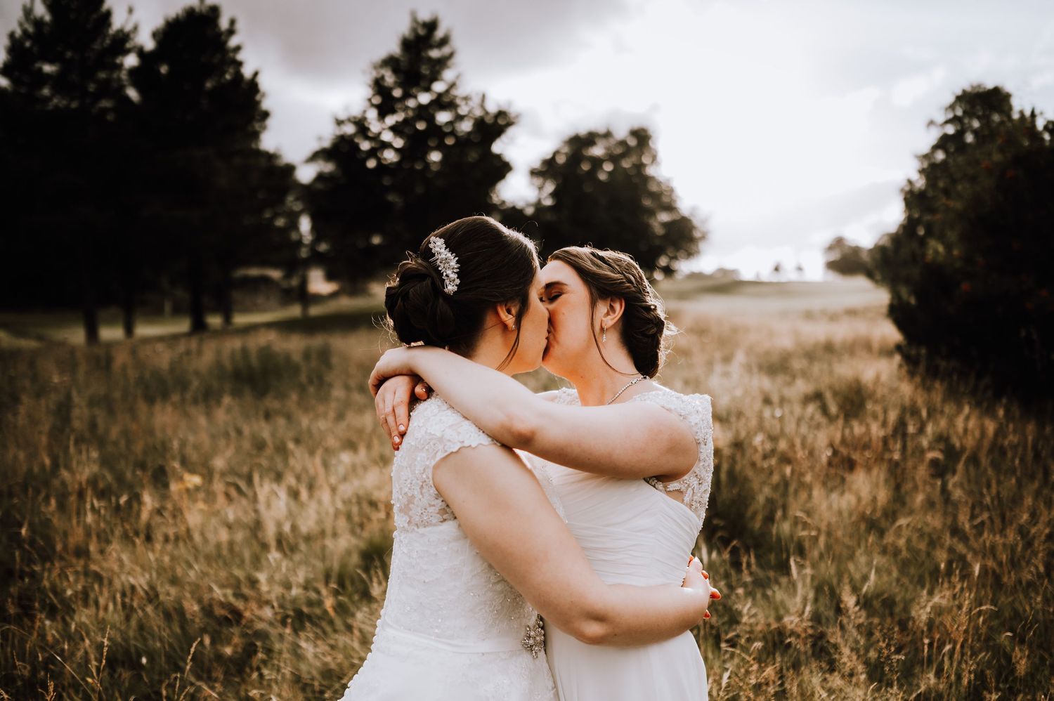 Romantic outdoor wedding moment captured in black and white against a natural backdrop. Meldrum House Wedding Photography.