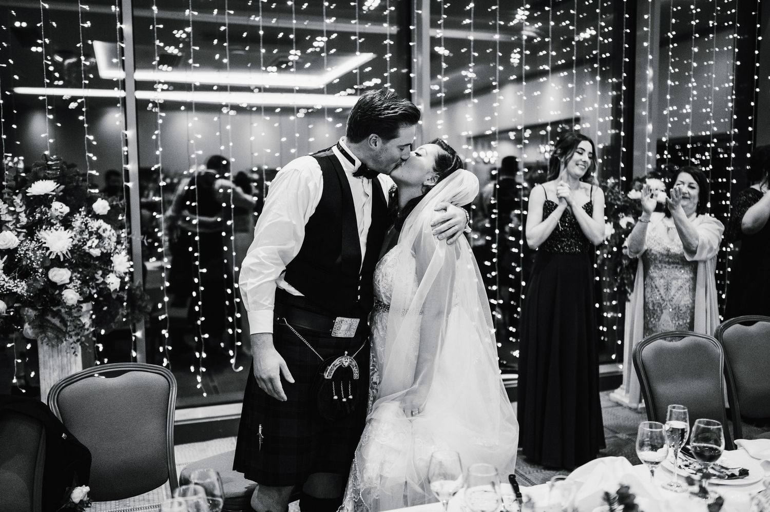 Aberdeen Wedding Photography. Celebration scene with twinkling lights and dancing at an evening wedding reception.
