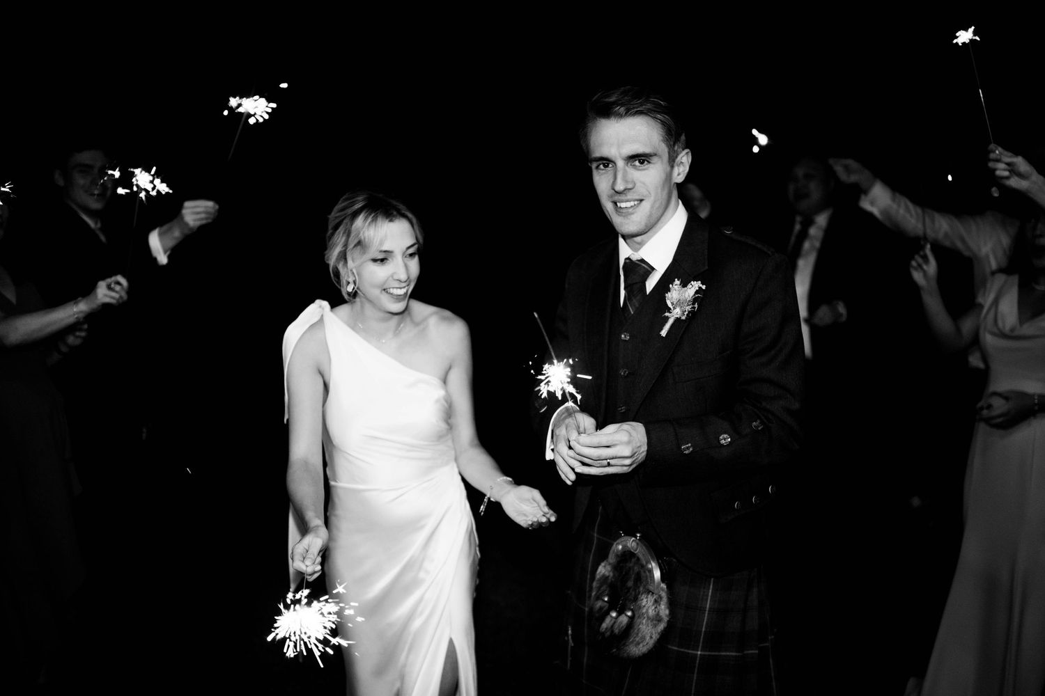 Black and white photos of wedding reception dancing and celebrations.