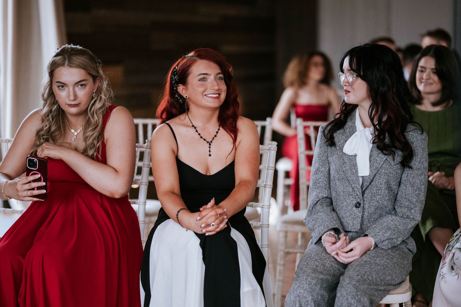 Wedding reception guests enjoying celebrations in an indoor venue.