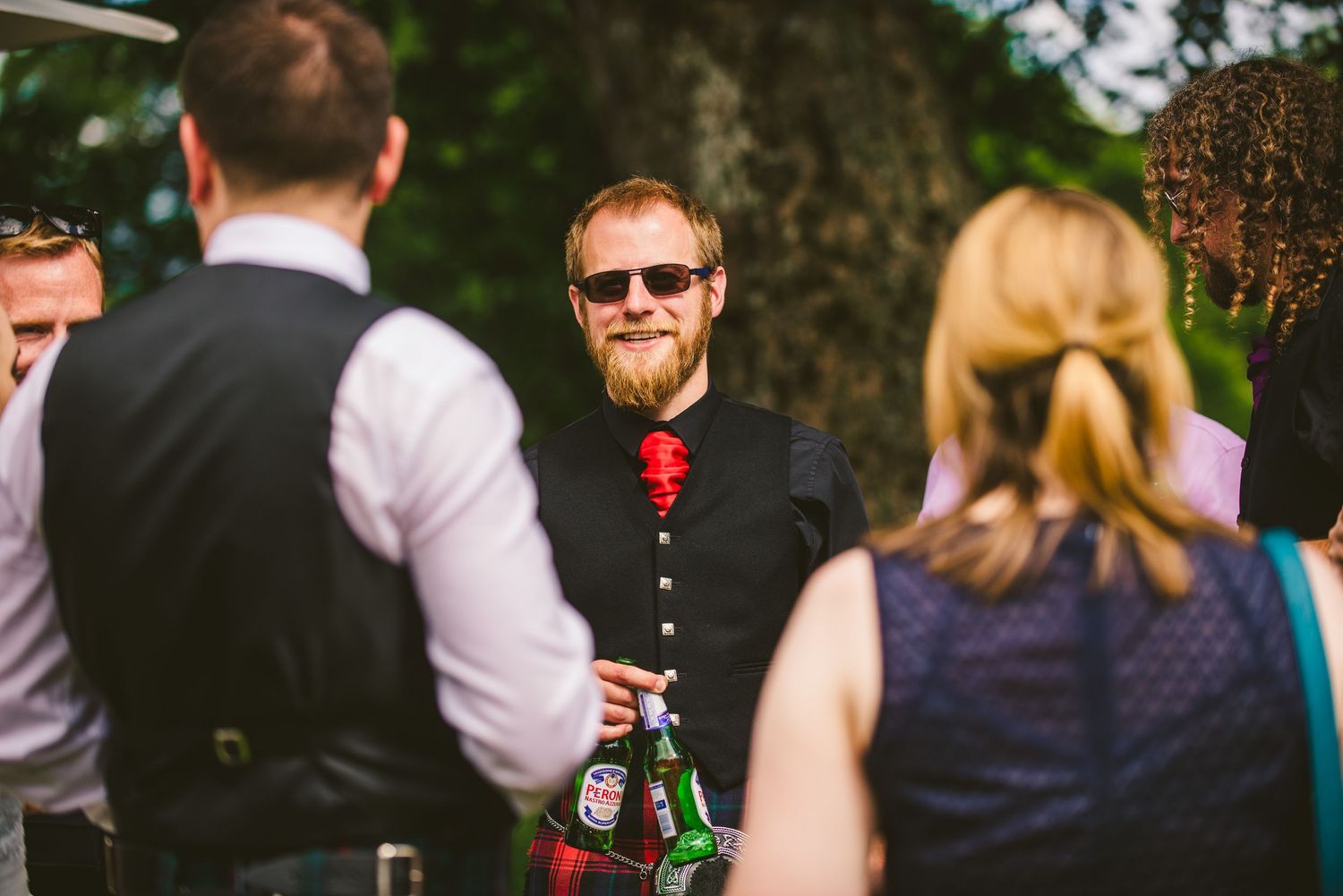 Wedding guests mingling and socializing during outdoor cocktail hour.