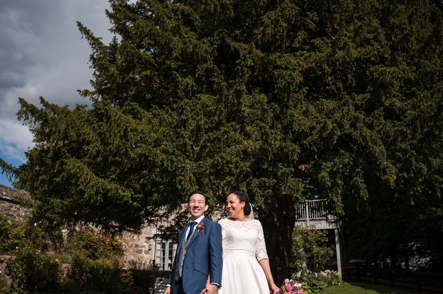 Outdoor wedding ceremony setup with trees and natural scenery in the background.