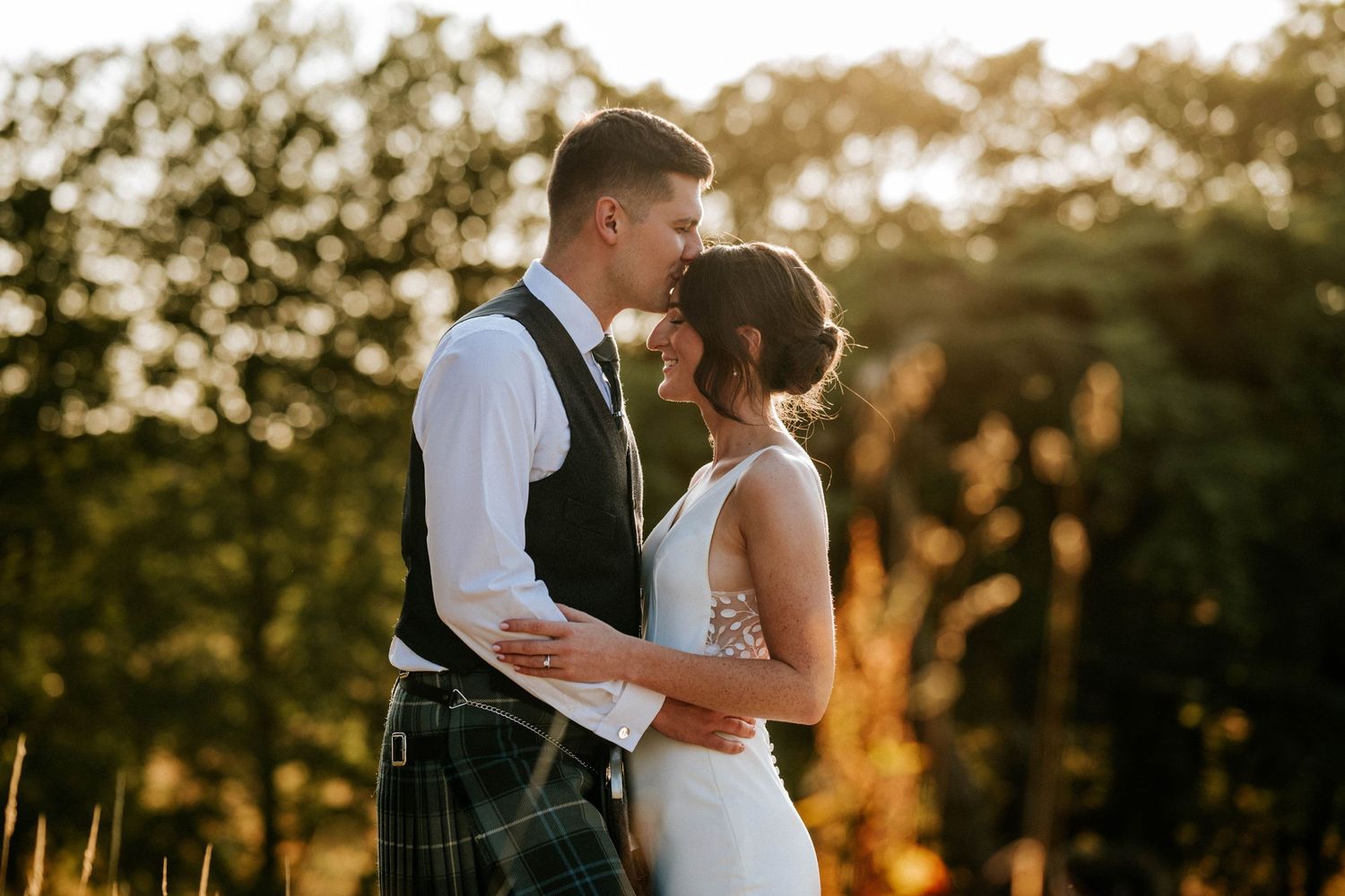 Aberdeen Wedding Photography. Romantic sunset wedding portraits in a scenic outdoor setting.