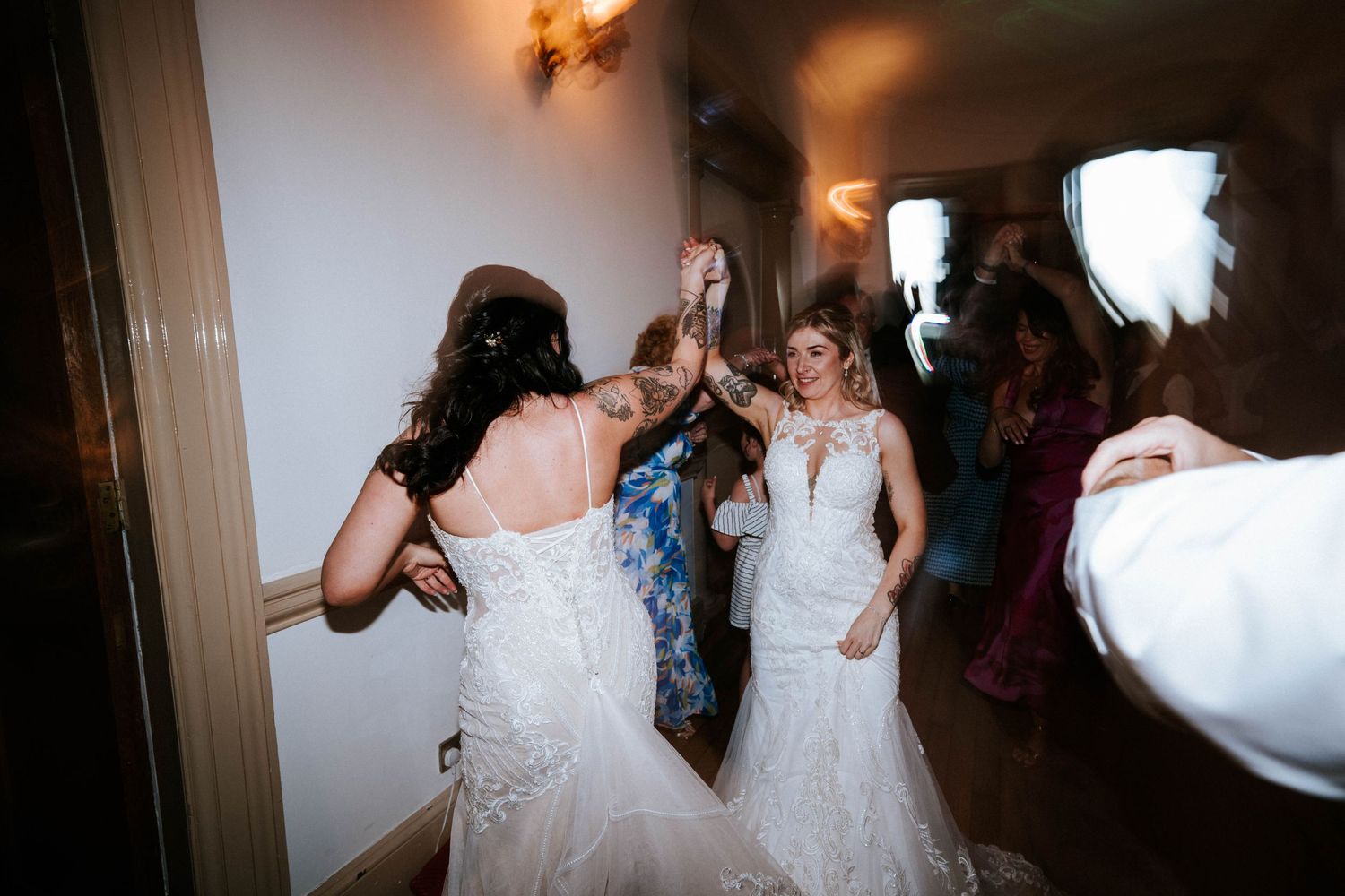 Aberdeen Wedding Photography. Motion-blurred dancing and celebration scenes in dimly lit indoor space.