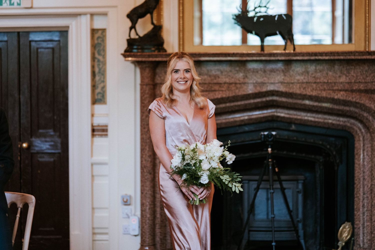 Interior of a grand wedding venue with vintage mirrors and elegant architectural details.