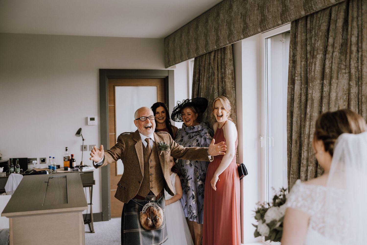 Wedding ceremony setup in elegant room with natural light streaming through windows. Meldrum House Wedding Photography.