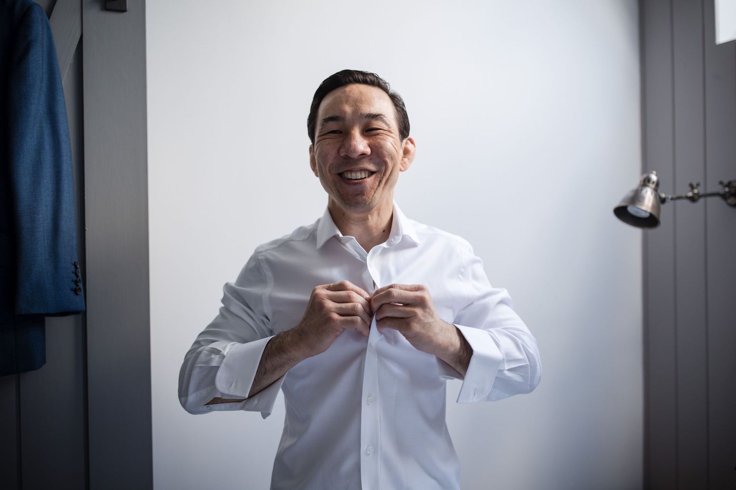 Series of photos showing someone adjusting a white formal shirt collar.