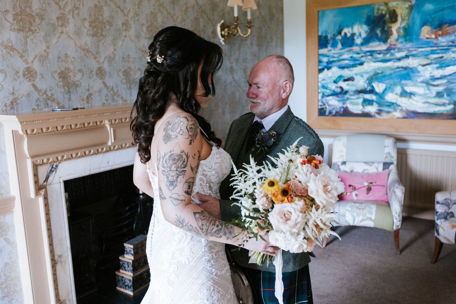 Wedding ceremony venue decorated with elegant floral arrangements and string lights for a romantic atmosphere.