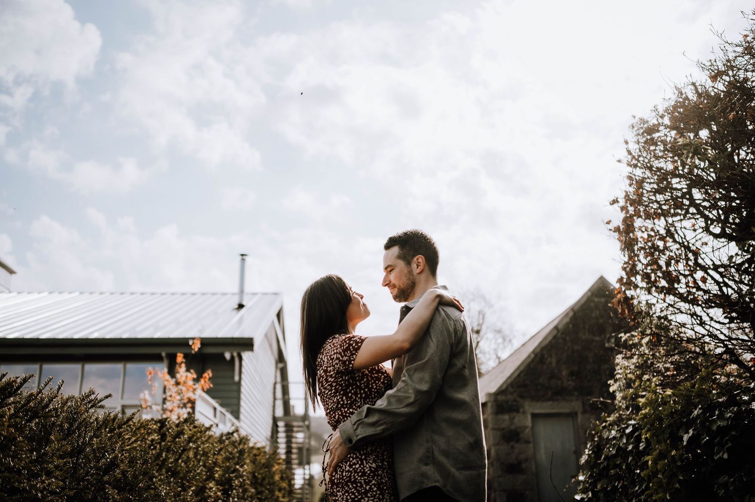 Engagement photography session Aberdeen. A romantic photoshoot in a rustic farm setting with greenhouse tunnels.