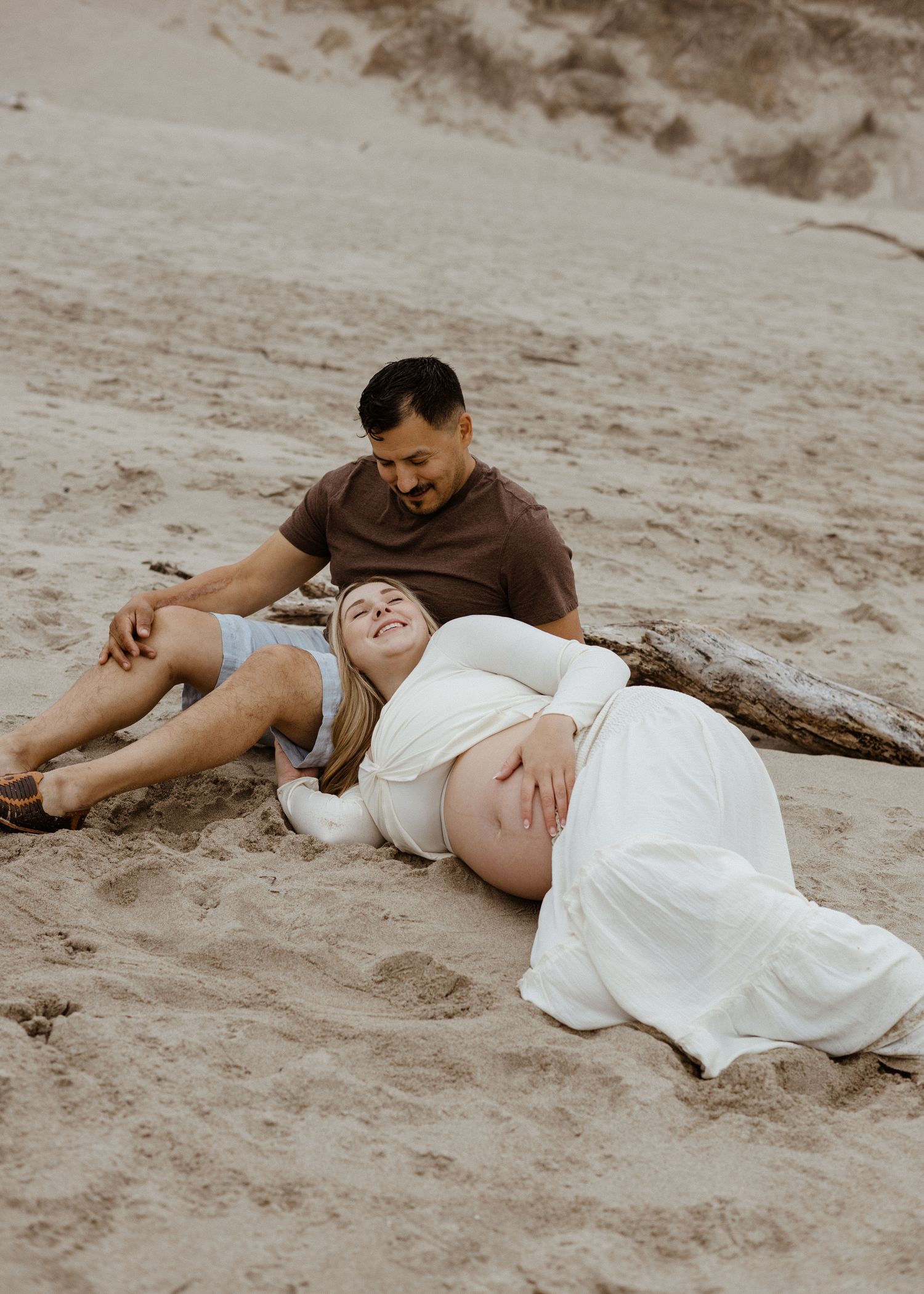 Candid maternity session Oregon coast beach in the summertime fog
