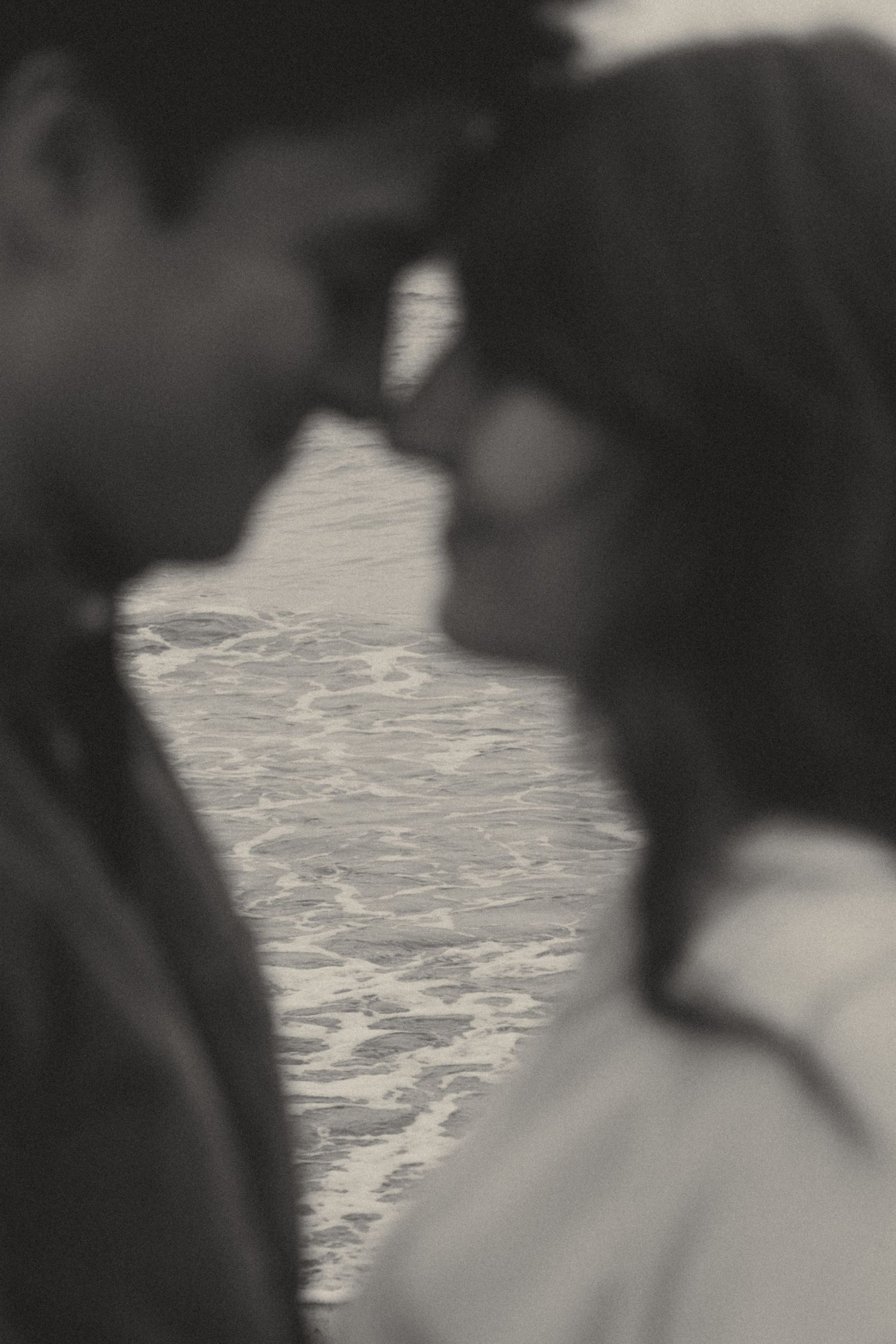Lincoln City, Oregon Beach Maternity/Anniversary session. couple blurred and ocean in focus by Andi Rane Photo Oregon Coast Photographer.