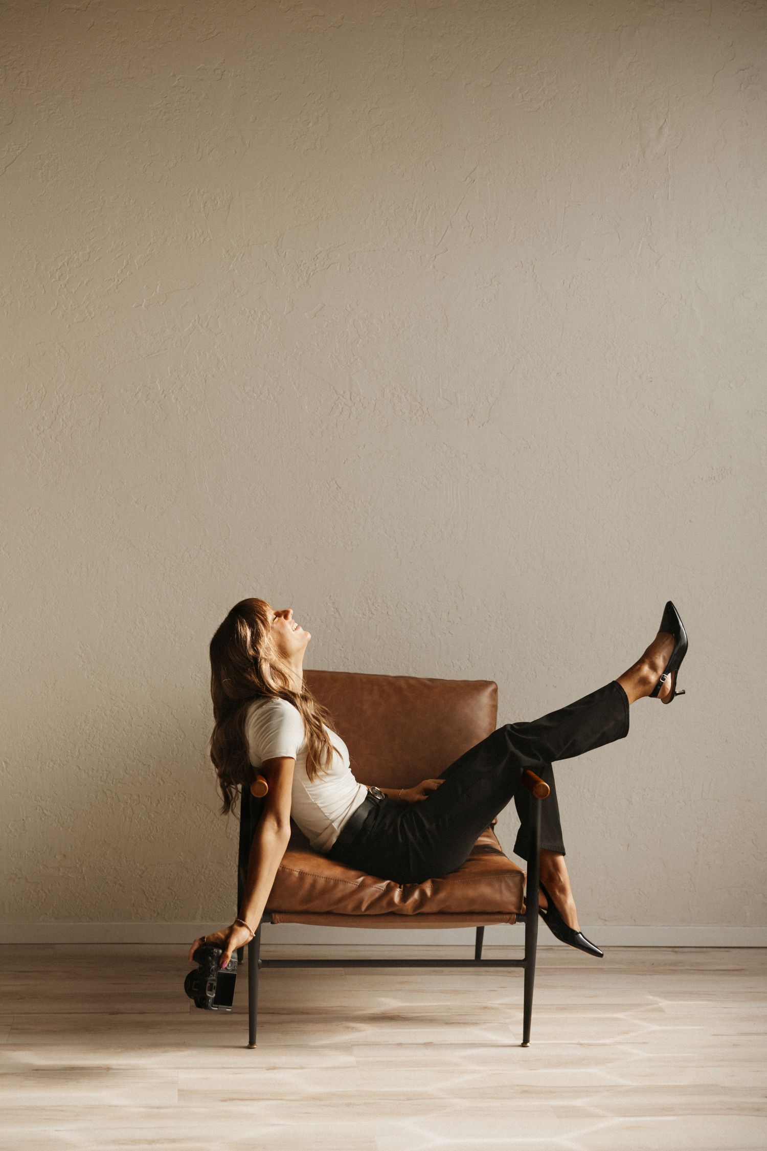 Portland intimate wedding photographer Andi Rane with camera