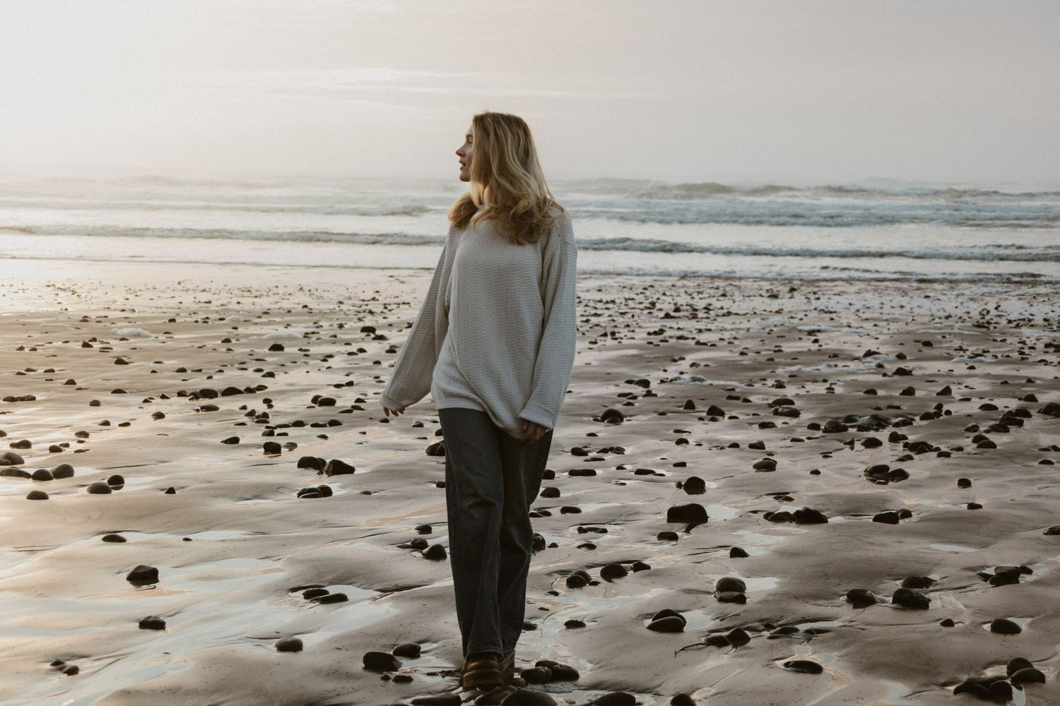 Oregon Model Session in Waldport oregon, walking on rocky beach captured by PNW documentary photographer Andi Rane Photo.