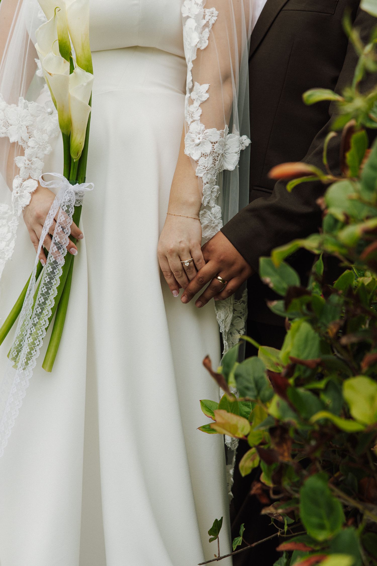 Portland Wedding photographer, close up ring shot  of couples hands intertwind for dreamy details during their Oregon Coast wedding
