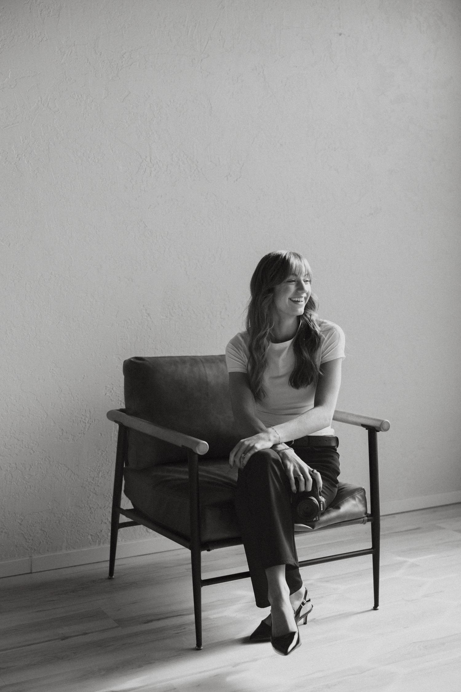 Studio branding session with Oregon Coast Photographer Andi Rane Photo sitting in cute chair with her camera