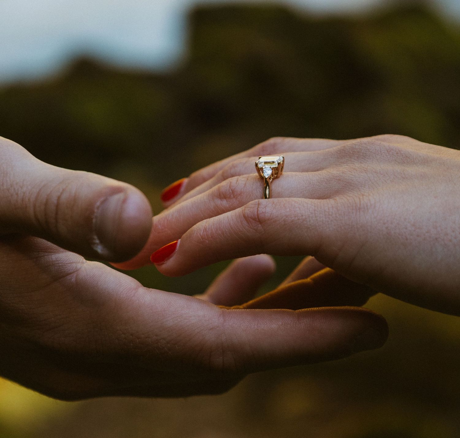 Detail Shot of beautiful emerald cut engagement ring during a Sahalie Falls, Oregon surprise proposal Captured by Andi Rane Photo.