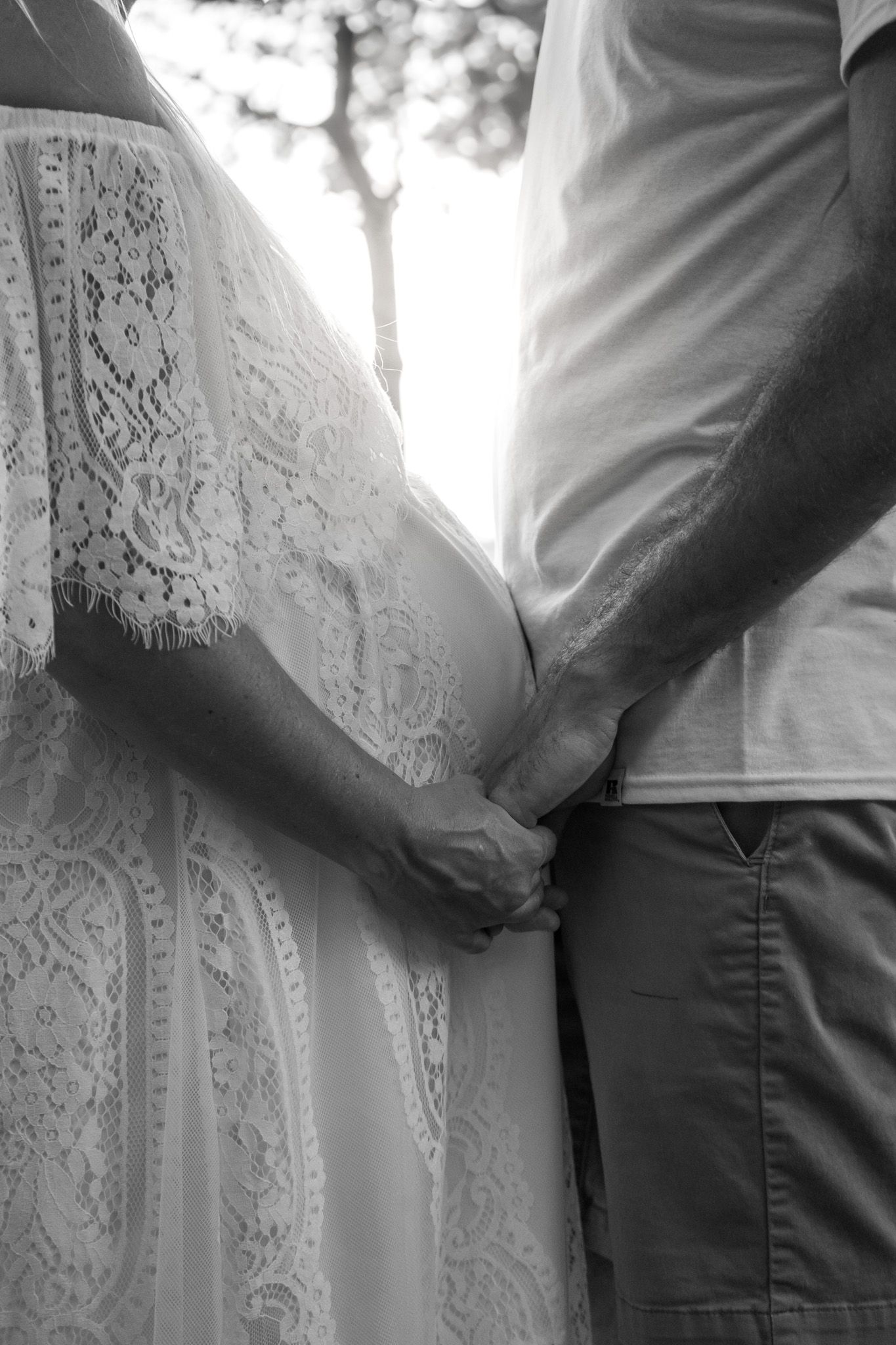 Black and white close-up shots highlighting maternity fashion details.