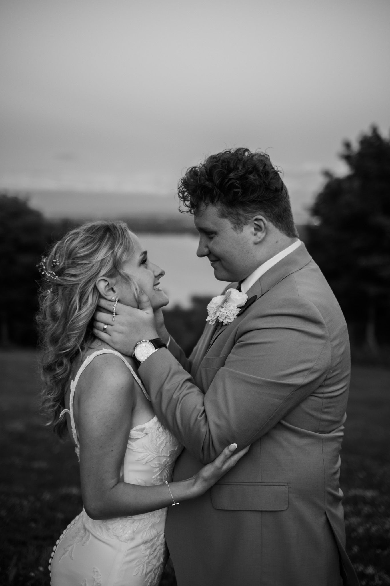 A romantic black and white wedding photo sequence showing a couple embracing and kissing outdoors.