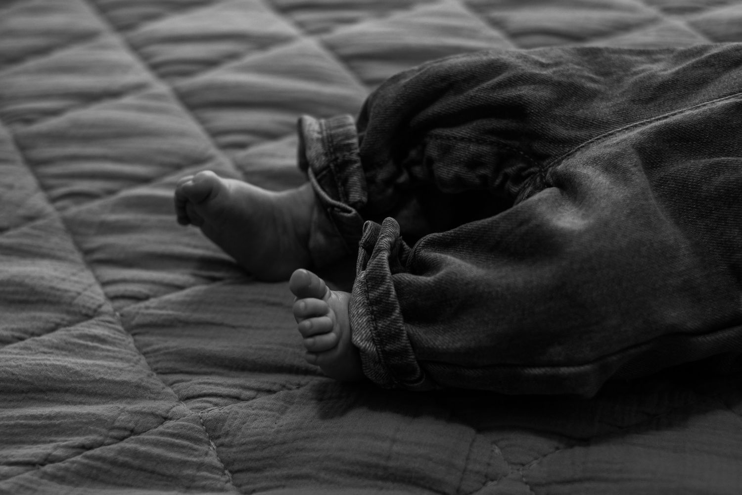 Abstract black and white composition featuring soft textures and diagonal lines.