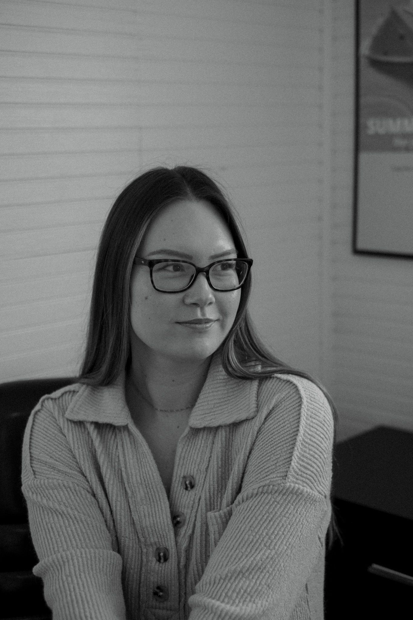 Portrait series showing someone wearing glasses and a beige ribbed sweater.