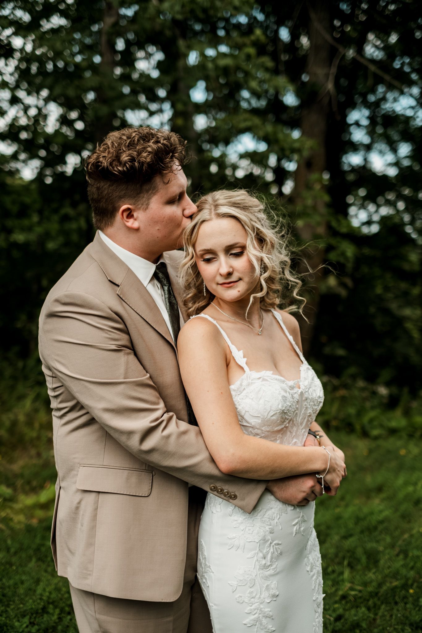 A romantic wedding photoshoot sequence showing tender moments between a couple in a natural outdoor setting.