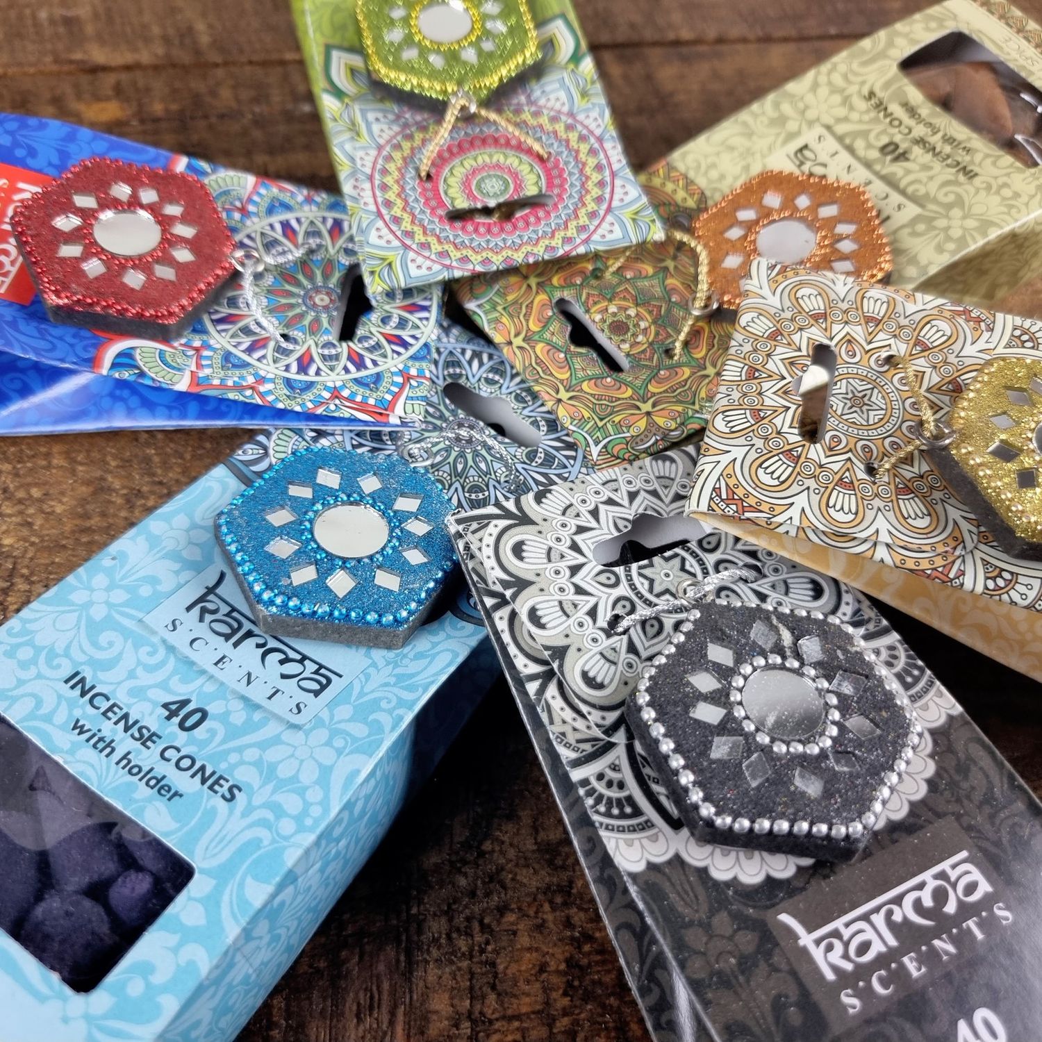 Colorful collection of Karma incense packages arranged in a circular pattern.