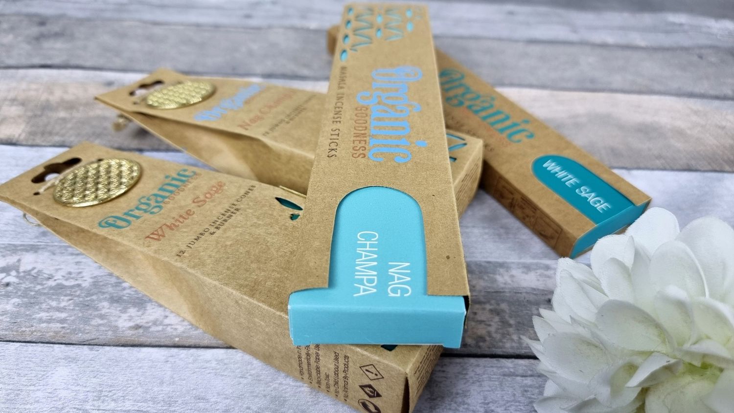 Natural bamboo incense sticks with eco-friendly packaging on wooden surface.