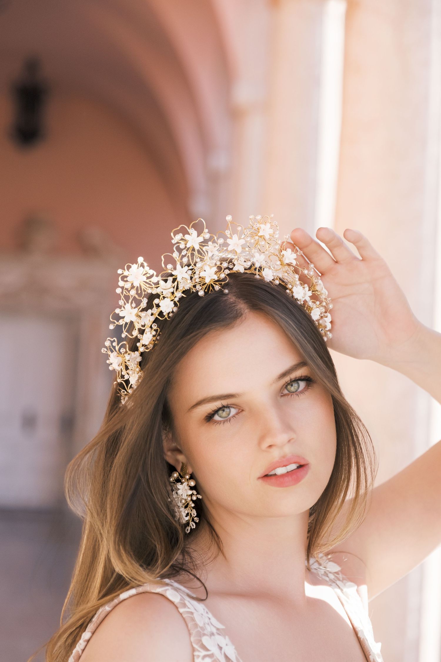 Beautiful bridal portrait with delicate gold floral crown and soft lighting in an elegant indoor setting. london wedding photographer