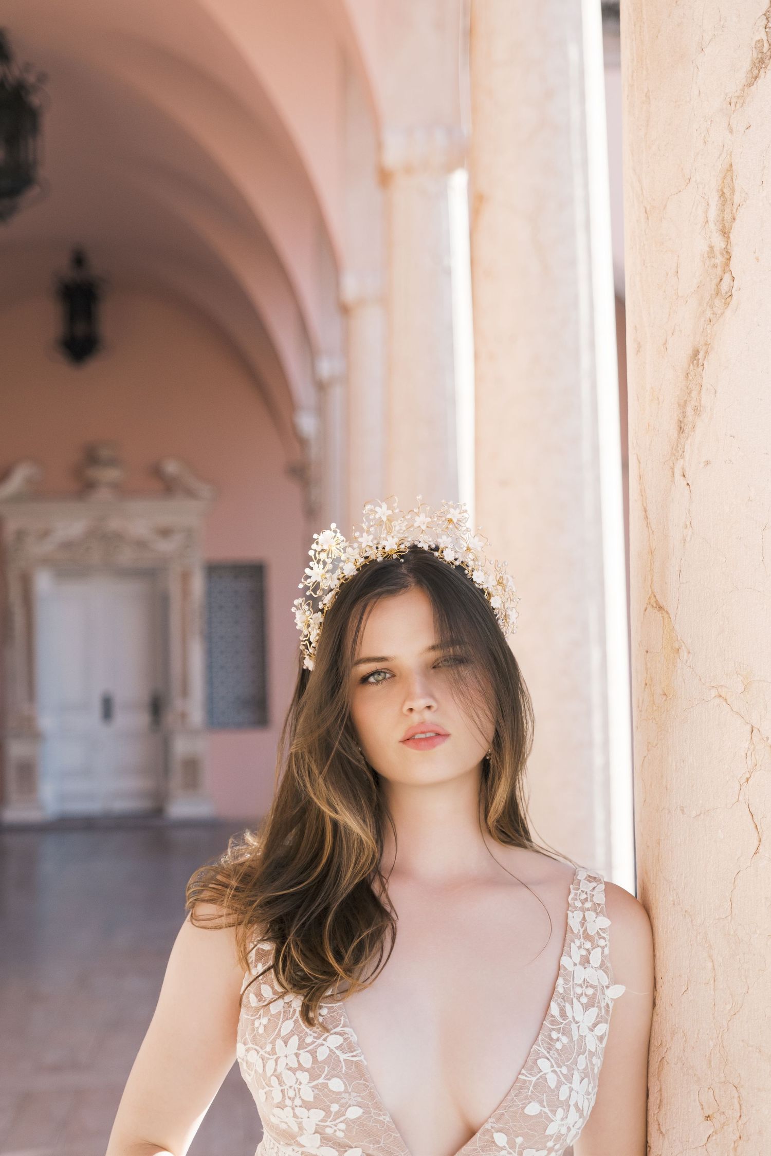 Beautiful bridal portrait with delicate gold floral crown and soft lighting in an elegant indoor setting. london wedding photographer