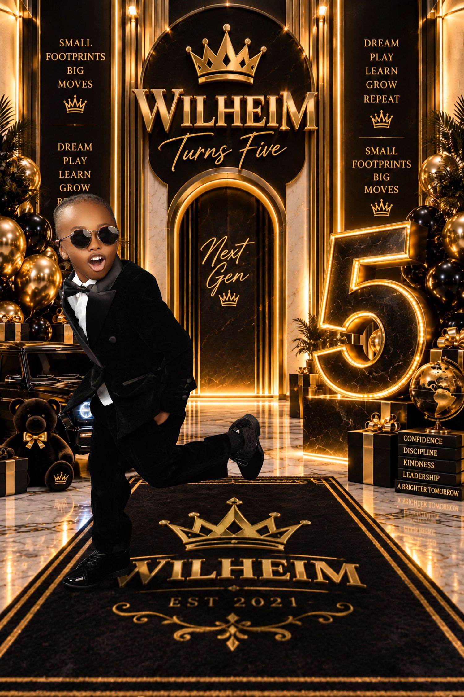 Boy in sunglasses and a black tuxedo poses on a black and gold carpet at a luxe 'Wilheim Turns Five' birthday backdrop with a gold number 5.