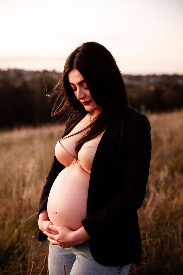 Sydney maternity photographer capturing with smart outfit