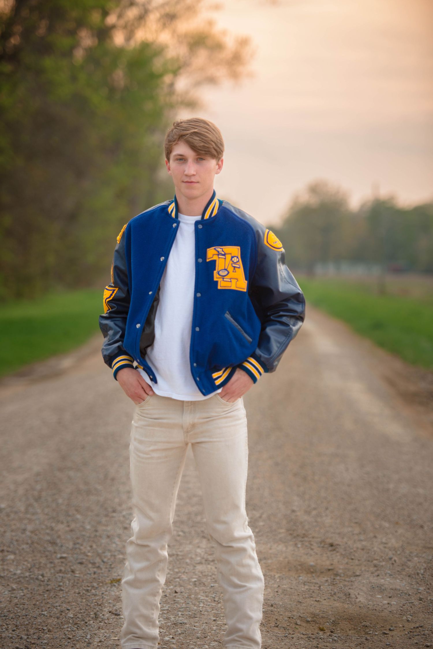 Tallulah la senior portrait session. Football, letterman, outdoor.